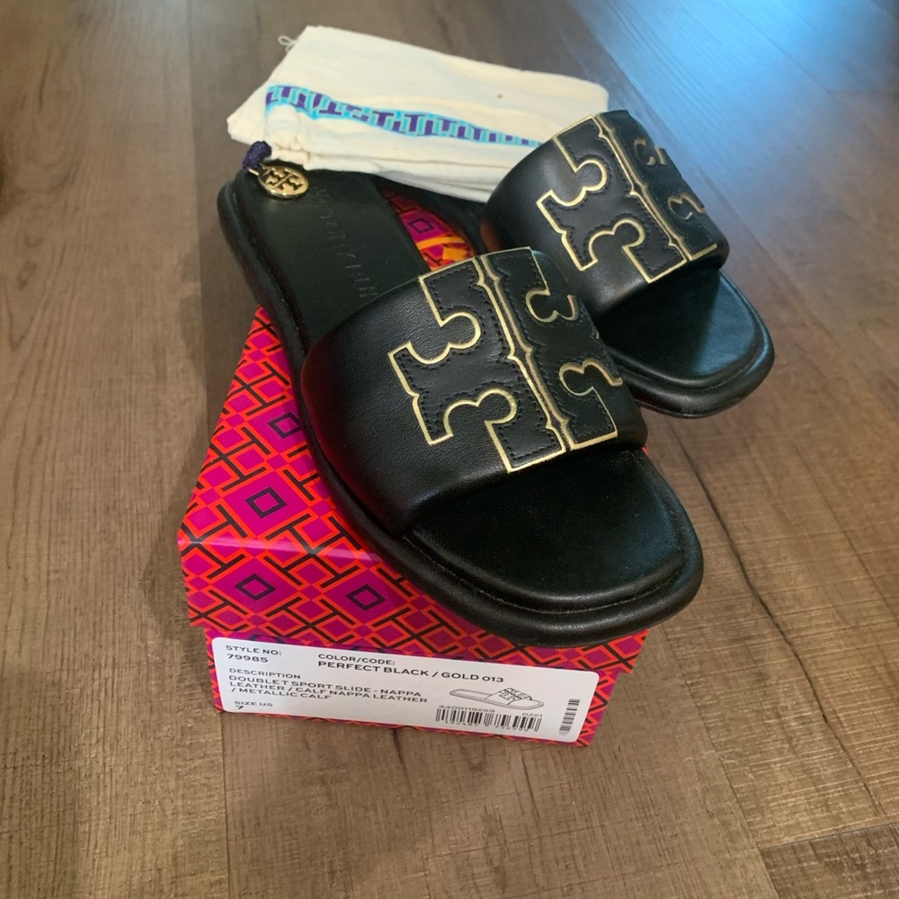 Tory Burch Black and Gold slide sandals